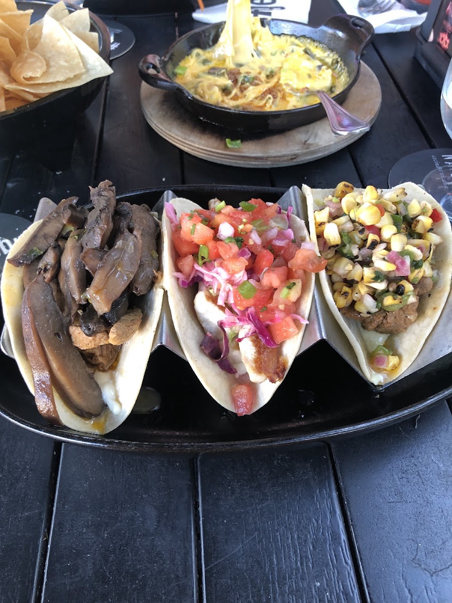 From left to right: sliced steak and mushroom taco, crispy Baja fish taco (grilled instead of fried), carne asada taco