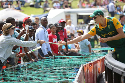 Morne Morkel of the Proteas signs bats for fans at Buffalo Park during the 3rd One-Day International yesterday Picture: MARK ANDREWS