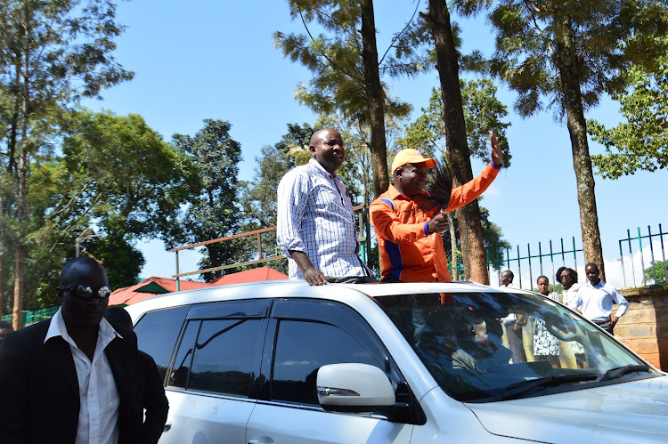 Lugari MP Ayub Savula and Kakamega governor candidate Fernandez Barasa after they received their nomination certificate from IEBC on Monday, June 6.