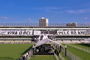 Flags remembering Pelé are displayed on the stands as mourners queue inside Vila Belmiro stadium to pay their respects to late football legend Pelé during his funeral in Santos, Brazil on January 2 2023. Brazilian football icon Edson Arantes do Nascimento, better known as Pele, died on December 29 2022 aged 82 after a battle with cancer in Sao Paulo, Brazil.