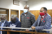 Albert Ramothwala, Oupa Mkhonza, Thabo Mosime and Michael Sandlana appearing in the Alexandra magistrate's court where they were charged with fraud.  