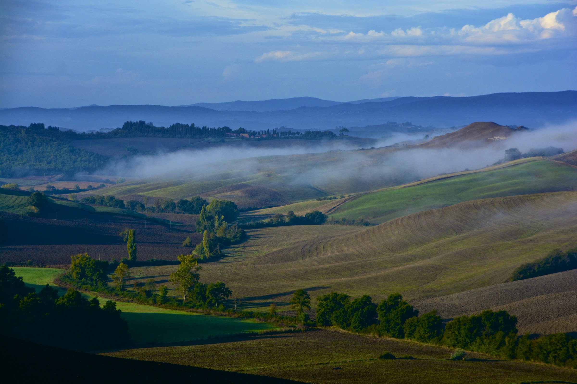 Fog in the morning in the Crete Senesi, Tuscany