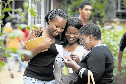 Some matrics, like Amanda Mntambo of Greenside High, left, had reason to celebrate this week when their results were announced. Sharing her joy is her sister, Gugu Mntambo, and mother, Linda Mntambo. File photo
