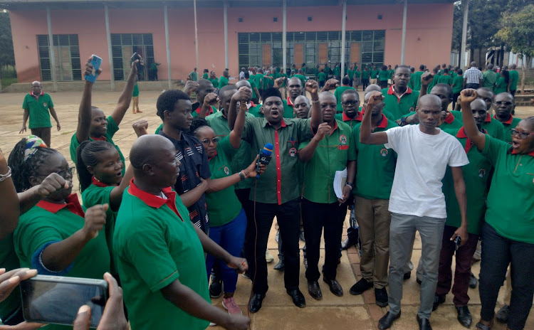 Knut national vice chairman Aggrey Namisi with the union's executive members from Kisumu county during a meeting at Nyamasaria primary school