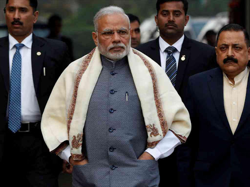 Prime Minister Narendra Modi walks to speak with the media as he arrives at the parliament house to attend the first day of the budget session, in New Delhi, India, January 31, 2017. /REUTERS