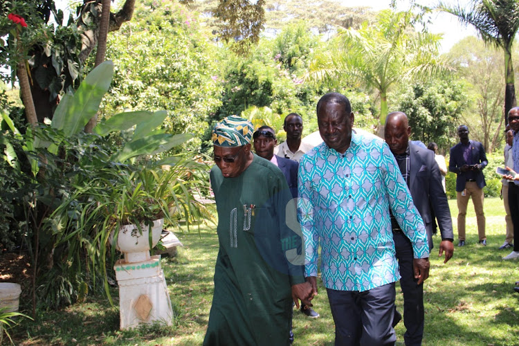 Former Nigerian president Olesegun Obasanjo and Azimio party leader Raila Odinga after a press conference with the media at his home in Karen, Nairobi on February 15, 2024