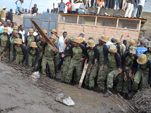 NYS personnel during a rescue in Manyatta estate, Kisumu, where a three-storey building collapsed on July 9 last year / MAURICE ALAL