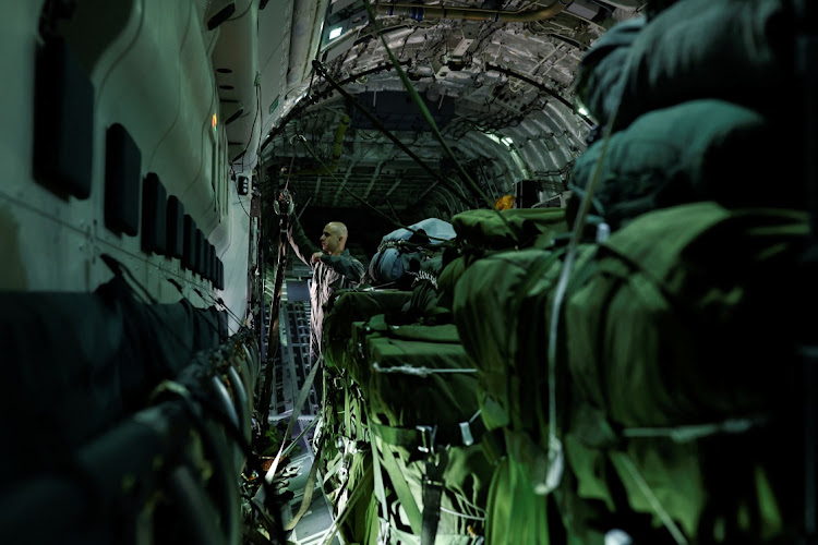 A member of the Brazilian Air Force prepares to launch supplies including food during a flight to the Surucucu base in Yanomami indigenous territory, Roraima state, Brazil on February 2, 2023. Picture: REUTERS/AMANDA PEROBELLI