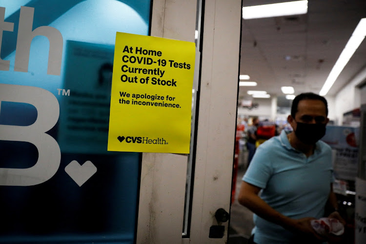 A sign is seen at the entrance of a pharmacy in Miami, Florida, on January 5 2022.