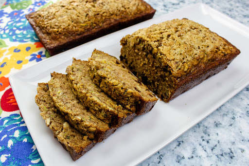 Delicious Zucchini Bread sliced and on a platter.