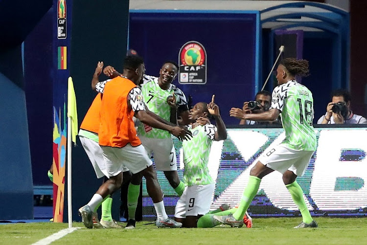 Nigeria's Odion Ighalo celebrates scoring their second goal with team mates.