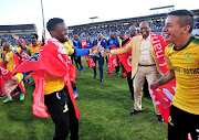 Motjeka Madisha celebrates with Mamelodi Sundowns billionaire president and teammate Gaston Sirino after the club won the 2017/18 Premiership title. 