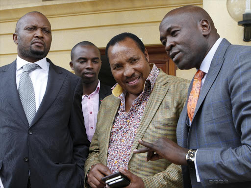 Gatundu South MP Moses Kuria and Kabete MP Ferdinand Waititu with their lawyer Cliff Ombeta at Milimani law courts on October 5 when they faced charges of incitement / MONICAH MWANGI