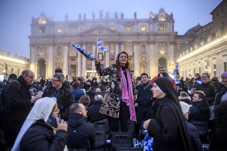Faithful attend the Pope Emeritus Benedict XVI funeral mass at St Peter's Square in Vatican City, Vatican, January 5 2023. Picture: ANTONIO MASIELLO/GETTY IMAGES