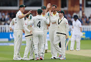  Mitchell Starc of Australia celebrates with teammates after dismissing Zak Crawley of England during Day Four of the LV= Insurance Ashes 2nd Test match at Lord's Cricket Ground on July 01, 2023 in London, England.