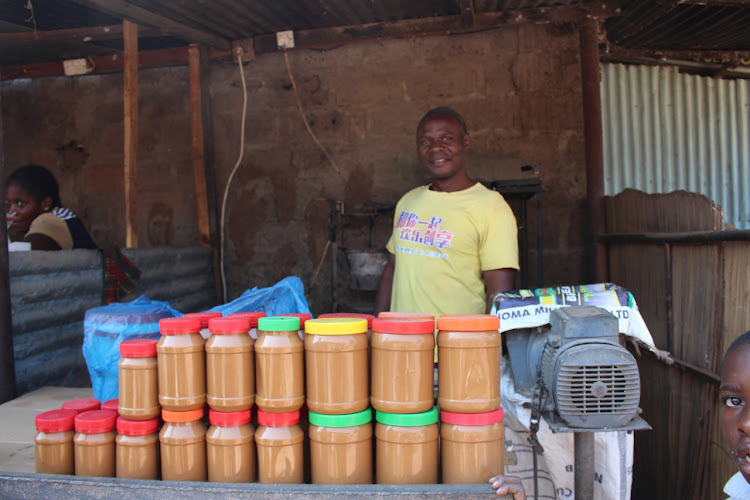 The peanut butter man at Dambwa Market makes it on site.