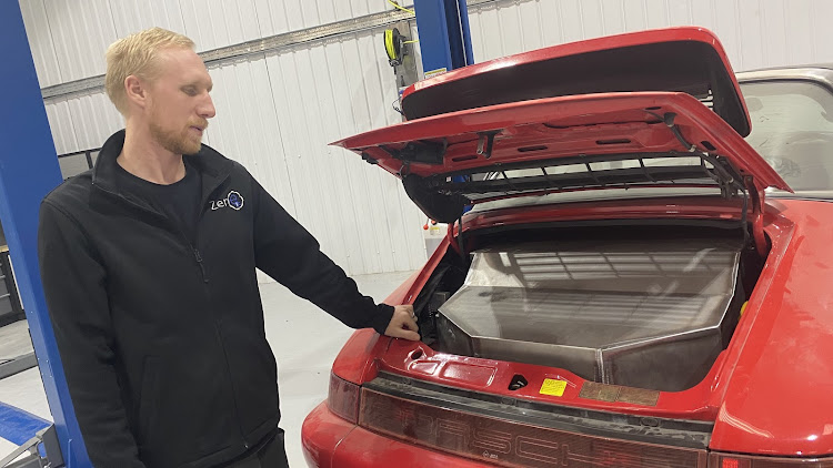 Chris Hazell of Zero EV explains the electric installation in a Porsche 911. Picture: SUPPLIED