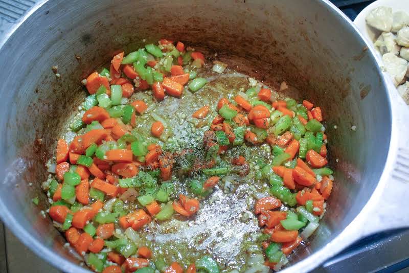 Cooking Onions, Celery, And Carrots In Butter.