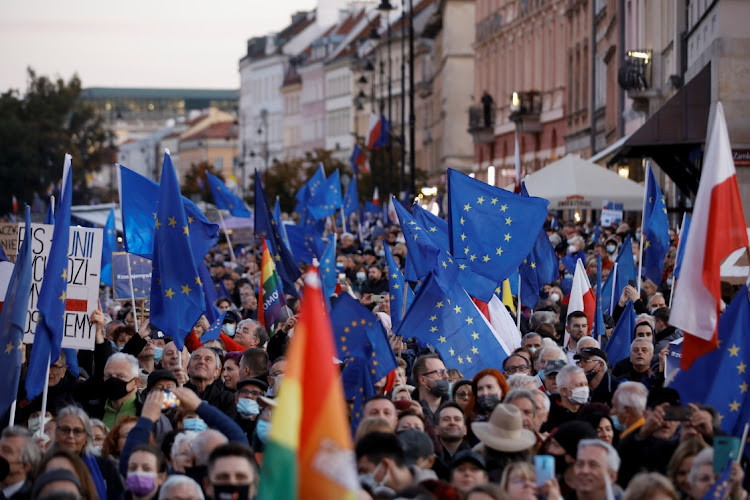 People march in a rally in support of Poland's membership in the EU after the country's Constitutional Tribunal ruled on the primacy of the constitution over EU law, in Warsaw, Poland, October 10 2021. Picture: REUTERS/KACPER PEMPEL