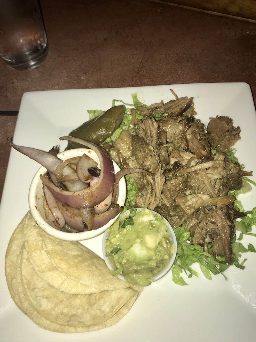 Carnitas plate with grilled onions and guacamole. It was DELICIOUS!!