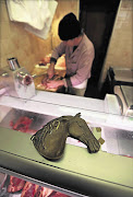 Charles Massa prepares horse meat in his horse butchery in the old city of Nice, France