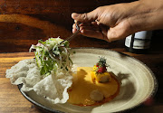 Coconut laksa with seafood cannelloni and tomato and galangal salsa.