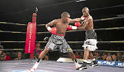 Lerato Dlamini, left, and Sydney Maluleke exchange blows during their WBC International fight which Dlamini won by a split points decision over 12 rounds on Sunday.