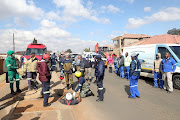 Members of EMS search for six-year-old Khayalethu Magadla in Klipspruit West.