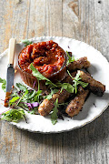 Homemade sausages with spicy ketchup.