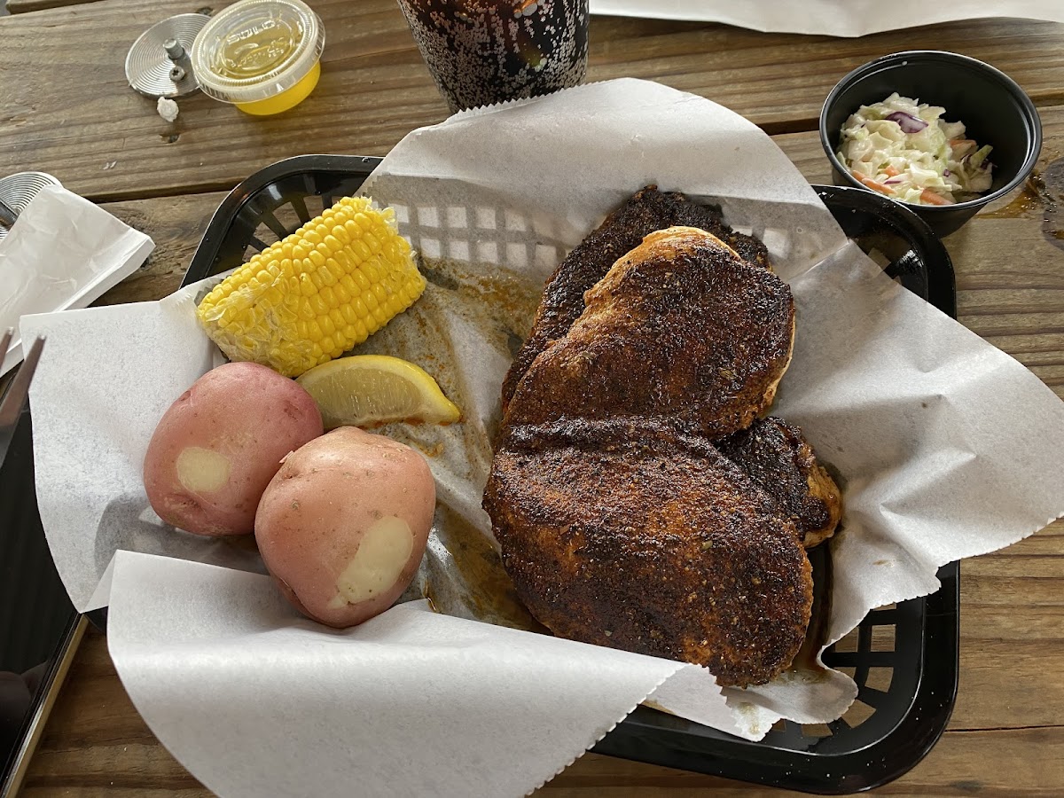 Blackened chicken with potatoes and corn on the con