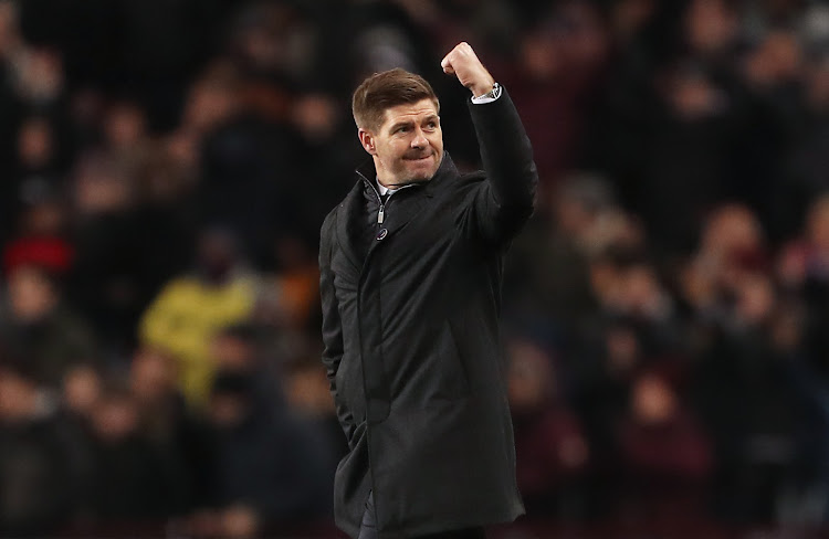 Aston Villa head coach Steven Gerrard celebrates on the pitch after their Premier League match against Leicester City at Villa Park on December 5