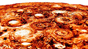 This computer-generated image shows the structure of the cyclonic pattern observed over Jupiter’s south pole. Like in the North, Jupiter’s south pole also contains a central cyclone, but it is surrounded by five cyclones with diameters ranging from 3,500 to 4,300 miles (5,600 to 7,000 kilometers) in diameter.