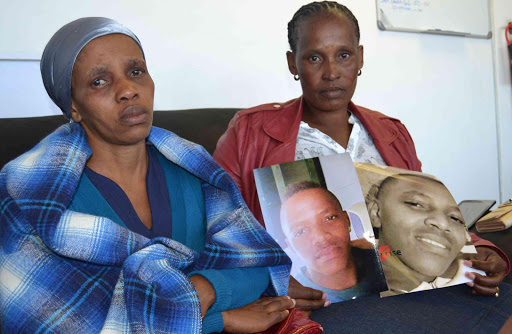 FOREVER GONE: Grieving mother Thumani Makhamba and aunt Nonzukiso Nkohla with a picture of Asiphe, 25, who was shot and killed by a policeman in Mandela Park informal settlement over the weekend Picture: LOYISO MPALANTSHANE