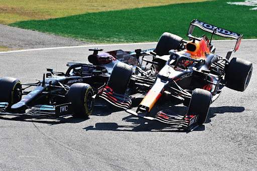 Max Verstappen and Lewis Hamilton crash during the F1 Grand Prix of Italy at Autodromo di Monza on September 12, 2021 in Monza, Italy.