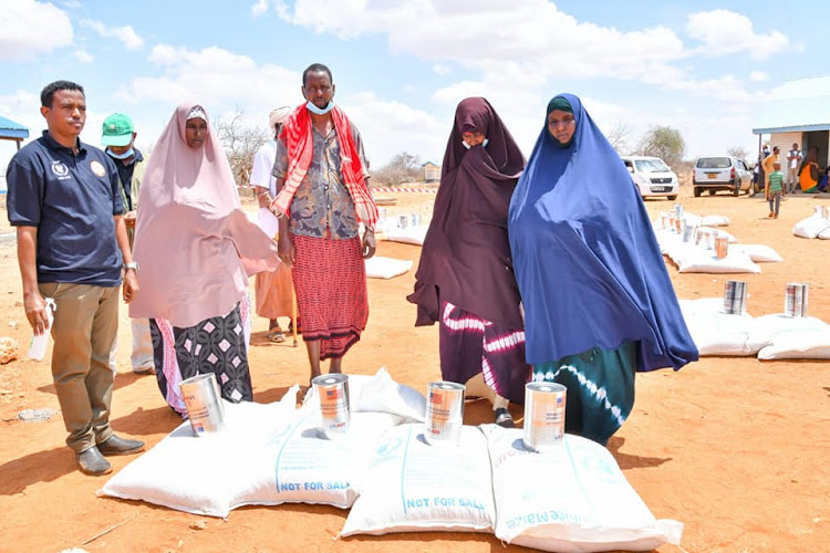 Residents of Nunow in Garissa county during the relief food distribution on April 26.