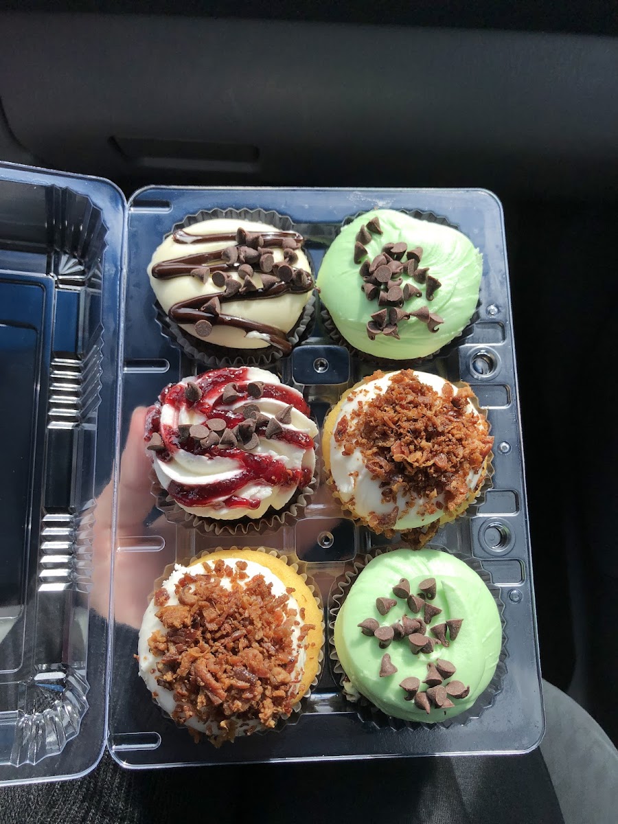 From top left: chocolate cheesecake, mint chocolate chip (2), raspberry, maple bacon (2)