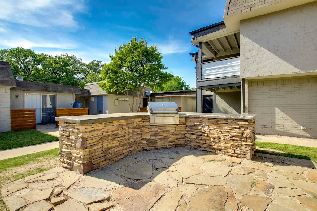 BBQ Grill area with stone countertops and stepping stone flooring