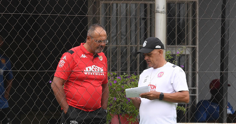 Highlands Park director Larry Brookestone (L) in a discussion with head coach Owen da Gama (R) at the club's training base in Johannesburg on March 11 2020 just before the coronavirus-enforced lockdown kicked it.