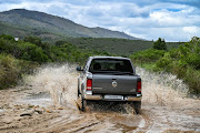 Rear styling is amplified by chrome bright-work and style-bar above the rear load-bay.