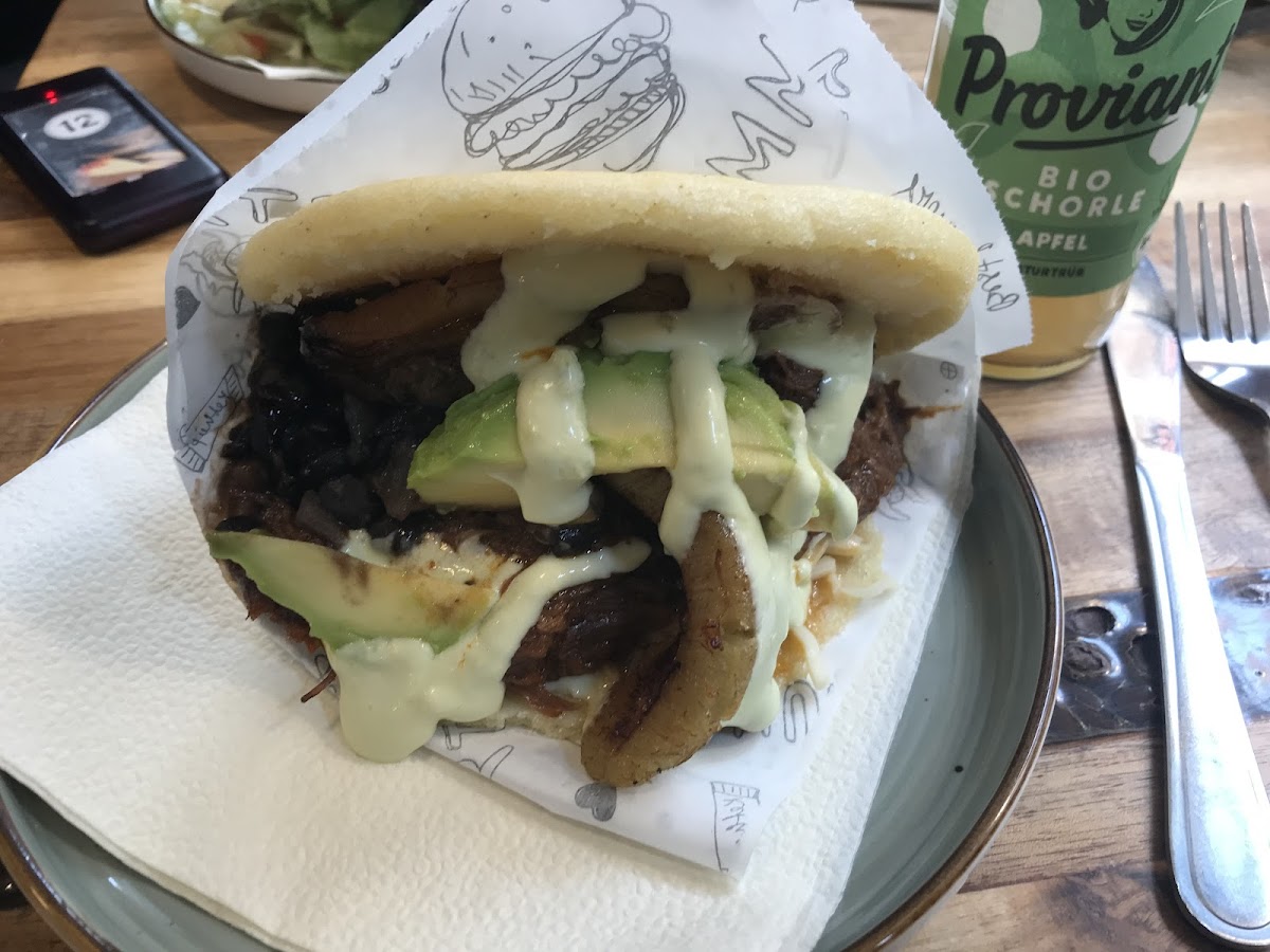 Arepa Pabellon Criollo (pulled beef, black beans, plantains, cheese, avocado, rice)