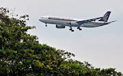 FILE PHOTO: A Singapore Airlines Airbus A330-300 airplane approaches to land at Changi International Airport in Singapore June 10, 2018.  