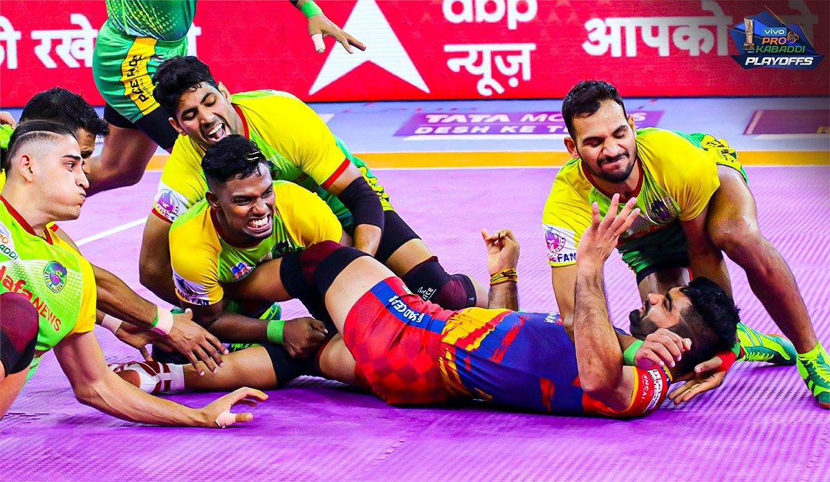 Patna with a team tackle on Pardeep Narwal as they ground him to the mat