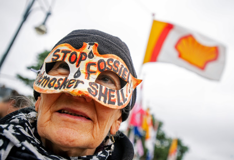 An environmental activist protests outside Royal Dutch Shell’s AGM in Scheveningen, Netherlands, in this file photo taken on May 21 2019. Picture: REUTERS/PIROSCHKA VAN DE WOUW