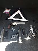 Some of the firearms found by police after they searched a vehicle in Laingsburg. Two suspects believed to be wanted in Gauteng, Limpopo and North West were arrested.