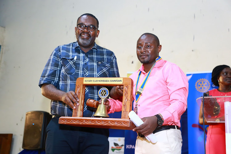 Rotary Club of Mombasa outgoing president Peter Odero hands over to incoming president Hassan Mbondo at KPA Mbaraki Sports Club on Saturday