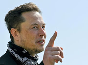 Elon Musk gestures as he visits the construction site of Tesla's Gigafactory in Gruenheide near Berlin, Germany. File photo.