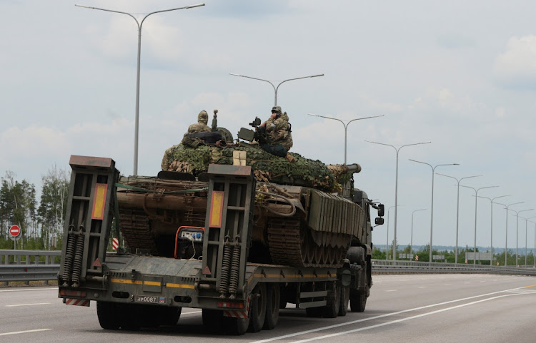 A truck transports a tank of Wagner private mercenary group along M-4 highway, which links the capital Moscow with Russia's southern cities, near Voronezh, Russia, on June 24 2023. Picture: REUTERS/Stringer