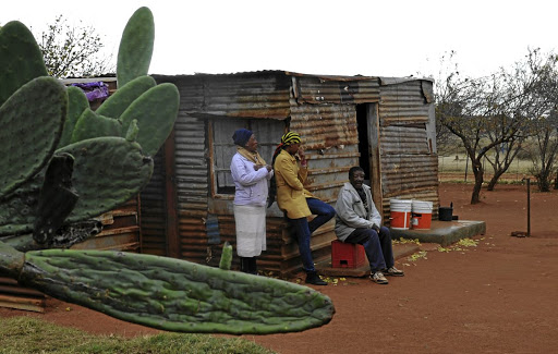 Kleinboy Dinake, daughter Stokkie and granddaughter Masego at their home at GaMogopa village in Ventersdorp.