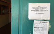 Notices on the door of the shut down Home Affairs office in Atlantis on Friday. 