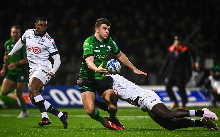 Tom Farrell of Connacht is tackled by Yaw Penxe of the Sharks during the United Rugby Championship match in Galway.